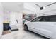 Spacious garage with room for a vehicle, storage, and side access at 462 Lake View Way, Auburndale, FL 33823