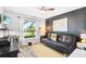 Functional home office with sleek furniture and a comfortable sofa for work or relaxation at 462 Lake View Way, Auburndale, FL 33823