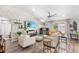 Living room with vaulted ceilings and a white brick accent wall at 462 Lake View Way, Auburndale, FL 33823
