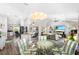 Spacious open-concept living area with dining table, kitchen and living room at 462 Lake View Way, Auburndale, FL 33823