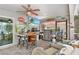 Enjoy this outdoor kitchen and entertaining area with stainless grill, bar seating, and mounted TV at 462 Lake View Way, Auburndale, FL 33823