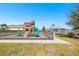 Community playground with slide, climbing wall, and gazebo overlooking the lake at 462 Lake View Way, Auburndale, FL 33823