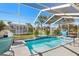Sparkling screened-in pool features a waterfall feature and a peek at the backyard at 462 Lake View Way, Auburndale, FL 33823