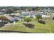 Aerial view of a community featuring a pool, shuffleboard courts, and well-maintained green spaces at 5091 Fox Cliff Dr, Lakeland, FL 33810