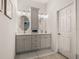 Modern bathroom with a double vanity, stylish mirrors, and contemporary lighting at 5556 Hogan Ln, Winter Haven, FL 33884