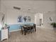 Dining room featuring modern decor, comfortable seating, and an open view to the entry at 5556 Hogan Ln, Winter Haven, FL 33884