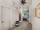 Hallway view into the Primary bedroom with ensuite bathroom and blue accent wall at 5556 Hogan Ln, Winter Haven, FL 33884