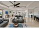 Open-concept living room showcases a stylish sofa, decorative accents, and seamless flow to the kitchen at 5556 Hogan Ln, Winter Haven, FL 33884