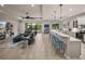This open layout allows a seamless transition from living area to the well-equipped kitchen and access to lanai at 5556 Hogan Ln, Winter Haven, FL 33884