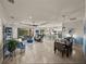 Expansive open-concept living room and kitchen with tile floors, modern furnishings, and ample space for entertaining at 5556 Hogan Ln, Winter Haven, FL 33884