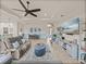 Relax in this living room with stylish decor, comfortable seating, and seamless transition to the dining area at 5556 Hogan Ln, Winter Haven, FL 33884