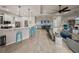 Spacious living area connects to a modern kitchen and dining space, perfect for entertaining and relaxing at 5556 Hogan Ln, Winter Haven, FL 33884
