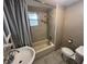 Bathroom features a shower-tub combo, with a single sink and standard toilet at 626 N Nashua Ave, Fort Meade, FL 33841
