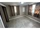 Bedroom with tile flooring and multiple windows providing ample natural light at 626 N Nashua Ave, Fort Meade, FL 33841