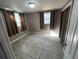 Comfortable bedroom with natural light and tile flooring at 626 N Nashua Ave, Fort Meade, FL 33841