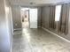 Neutrally designed bedroom with tile flooring, and great natural light at 626 N Nashua Ave, Fort Meade, FL 33841