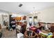 Open floor plan from the living room to the kitchen and the dining room with chandelier at 6261 Red Grange Blvd, Indian Lake Estates, FL 33855