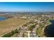 Aerial view of a neighborhood with lake views and various home styles and sizes at 633 Hart Lake Dr, Winter Haven, FL 33884