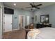 Tranquil main bedroom featuring a ceiling fan, and a walk-in closet for ample storage at 633 Hart Lake Dr, Winter Haven, FL 33884