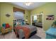 Charming bedroom with decorative pillows, accent chair, and unique decor elements, offering a cozy retreat at 633 Hart Lake Dr, Winter Haven, FL 33884