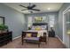 Serene main bedroom boasts a large window, bench, and neutral color scheme, creating a calm and relaxing retreat at 633 Hart Lake Dr, Winter Haven, FL 33884