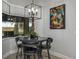 Cozy breakfast nook with backyard views and modern lighting fixture at 633 Hart Lake Dr, Winter Haven, FL 33884