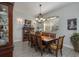 Formal dining room featuring a wooden table, seating for eight, and stylish decor at 633 Hart Lake Dr, Winter Haven, FL 33884