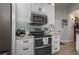 Modern kitchen with stainless appliances, granite countertops, and ample cabinet space at 633 Hart Lake Dr, Winter Haven, FL 33884
