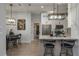 Bright eat-in kitchen boasts stainless appliances, granite counters, and pendant lighting at 633 Hart Lake Dr, Winter Haven, FL 33884