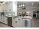 Open concept kitchen features granite counters, stainless appliances and pendant lighting at 633 Hart Lake Dr, Winter Haven, FL 33884