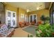 Inviting outdoor living space on the lanai with comfortable seating and lush greenery at 633 Hart Lake Dr, Winter Haven, FL 33884