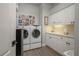 Convenient laundry room with washer, dryer, sink and ample counter space at 633 Hart Lake Dr, Winter Haven, FL 33884