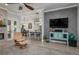 Open-concept living room showcasing modern furnishings and seamless integration with the dining and kitchen areas at 633 Hart Lake Dr, Winter Haven, FL 33884