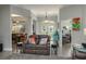 Open-concept living room with hardwood floors, neutral walls, and comfortable seating arrangement at 633 Hart Lake Dr, Winter Haven, FL 33884