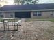 Spacious backyard with brick patio and seating, perfect for outdoor gatherings at 700 E Park Rd, Haines City, FL 33844