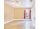 Bright and airy bedroom with wood-look floors and a window with red curtains at 700 E Park Rd, Haines City, FL 33844