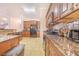 Spacious kitchen with granite countertops, stainless steel appliances, and ample cabinet space at 700 E Park Rd, Haines City, FL 33844