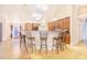 Open-concept kitchen with breakfast bar and seating for four, perfect for entertaining at 700 E Park Rd, Haines City, FL 33844