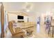 Bright and airy living room with a view into the dining and kitchen areas at 700 E Park Rd, Haines City, FL 33844