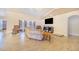 Spacious living room features neutral tones, tile floors and a large picture window at 700 E Park Rd, Haines City, FL 33844