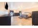 Spacious main bedroom with wood-look tile floors and neutral color palette at 700 E Park Rd, Haines City, FL 33844