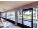 View from the screened in porch overlooking the backyard, showcasing the open space, pavers, and tranquil ambiance at 700 E Park Rd, Haines City, FL 33844