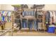 Organized walk-in closet with clothing racks and shelving for ample storage space at 700 E Park Rd, Haines City, FL 33844