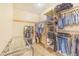Well-organized walk-in closet with clothing racks, shelving, and a full-length mirror at 700 E Park Rd, Haines City, FL 33844