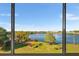 Stunning view of the lake through large windows from this home at 700 Mirror Ter Nw # 501, Winter Haven, FL 33881