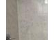 Stylish marble-patterned bathroom wall adding a touch of elegance to the space at 708 E Broadway St, Fort Meade, FL 33841