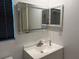Contemporary bathroom vanity with an LED mirror, combining functionality with modern flair at 708 E Broadway St, Fort Meade, FL 33841