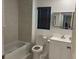 Bright bathroom with tub, shower, modern vanity, and large mirror at 708 E Broadway St, Fort Meade, FL 33841