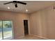 Spacious living room with tile flooring and sliding doors to the outside at 708 E Broadway St, Fort Meade, FL 33841