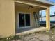 View of backyard patio with sliding glass door at 708 E Broadway St, Fort Meade, FL 33841